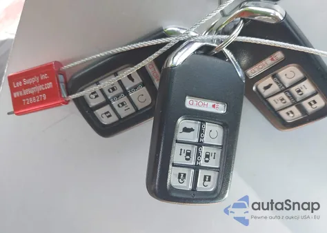 2018 Honda Odyssey Touring z USA, uszkodzony, nr VIN 5FNRL6H8XJB037572